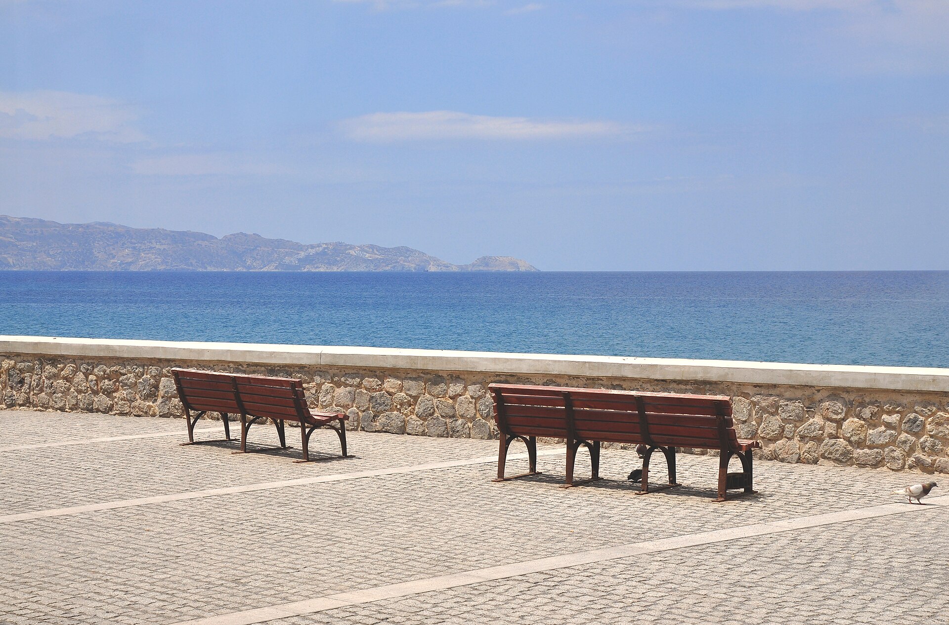 A seaside promenade overlooking the central Crete coastline